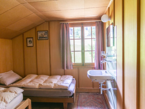 Room with twin and bunk beds